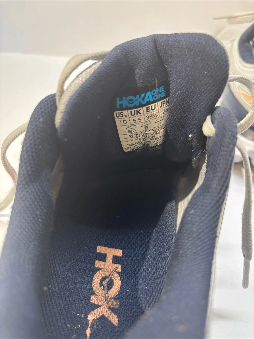 Hoka women’s size 7 gray/peach Bindi 7 style #110531 LRBI in fair condition.
